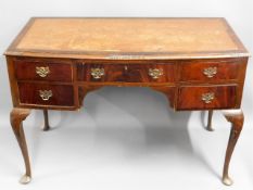 A mahogany desk with five drawers & brass fittings