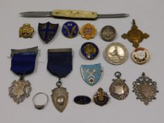 A selection of mixed vintage badges, medals includ