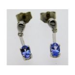 A pair of 14ct white gold tanzanite drop earrings,