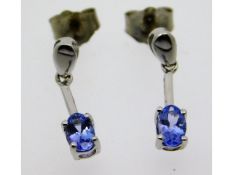 A pair of 14ct white gold tanzanite drop earrings,