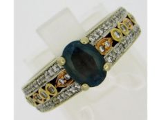 A 14ct two colour gold ring set with 0.6ct of diam