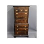 A George III oak chest on chest with brass fitting