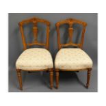 A pair of walnut bedroom chairs, 34in high to back