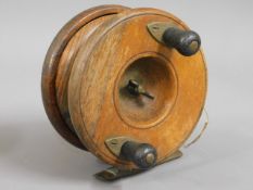 A vintage English made fly fishing reel with brass