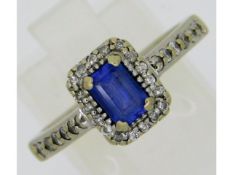 An art deco style 14ct gold ring set with emerald