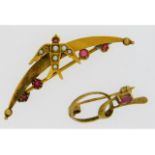 A 9ct gold garnet & pearl brooch with swallow deco