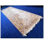 A decorative cream & floral design wool runner, 10