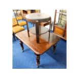 A Victorian extending mahogany table, lacking cent