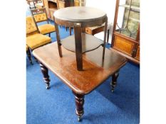 A Victorian extending mahogany table, lacking cent