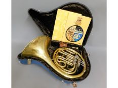 A cased brass Paxman Studenti model French horn