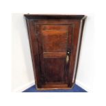 A George III oak corner cupboard, 42in high 28.5in