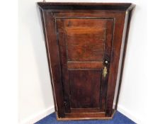 A George III oak corner cupboard, 42in high 28.5in