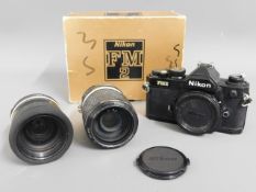 A Nikon FM2 35mm film camera with Nikon 43-86mm &