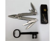 A leather cased Leatherman multi tool twinned with