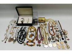A large quantity of mixed costume jewellery items & coinage including two £5 coins & four £2 coins &