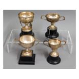 A selection of four silver tennis trophies won by