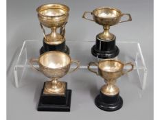 A selection of four silver tennis trophies won by