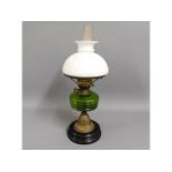 A c.1900 oil lamp with shade, 22in tall
