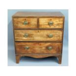 A compact George III walnut chest of four drawers
