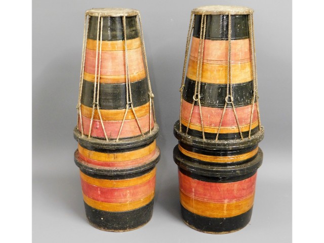 A pair of African tribal drums, 21in tall