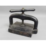 An extremely heavy, antique cast iron book press,