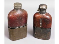 Two antique leather topped hip flasks with plated