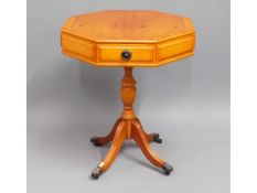 A reproduction octagonal occasional table with two