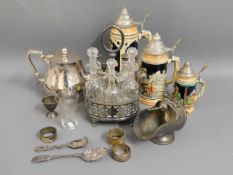 A silver plated teapot, a plated condiment set, th