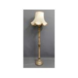 A "shabby chic" standard lamp with painted & silk