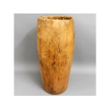 A carved wood African milk bucket, 22in high