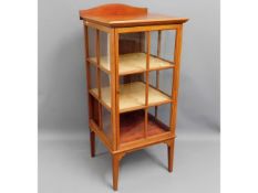A mahogany display cabinet. 52.5in high x 23in wid