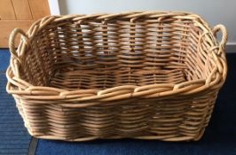 A large wicker log basket, 36in wide x 24 deep x 15.25in high
