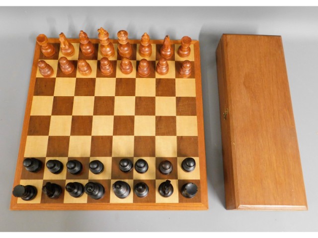 A carved wood chess set, King 4.5in tall, board 17