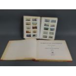 A vintage cigarette card album twinned with Norweg