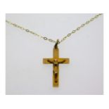 An 18in long 9ct gold chain with crucifix, 24mm hi