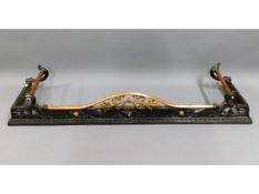 An ornate Victorian fire place fender with cast ir