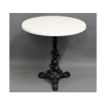 A faux marble table with cast pedestal, 27in diame