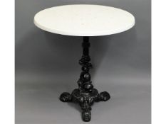 A faux marble table with cast pedestal, 27in diame