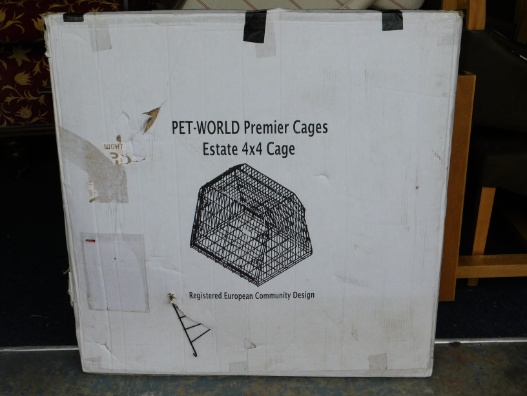 A boxed Pet World Premier Estate Cage 4x4