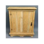 An antique pine cupboard with internal shelves, 33