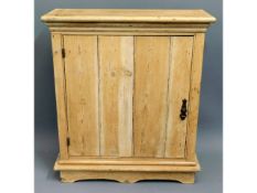 An antique pine cupboard with internal shelves, 33