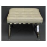 A Zebi white leather & chrome footstool, 23.5in wi
