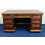A good quality reproduction mahogany pedestal desk