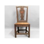 A 19thC. oak hall chair with carved decor, 39.5in