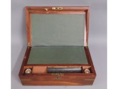 A 19thC. mahogany writing slope with a/f lock & br