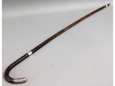 A gents cane bound walking stick with silver mount