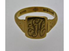 A 9ct gold signet ring initialed "SH", size N/O, 3