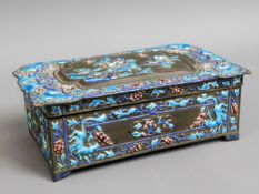 An Oriental box with applied enamel decor, two cha