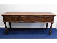 An 18thC. Georgian oak open dresser base with thre