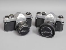 Two Pentax SP500 Asahi 35mm film cameras with lenses